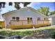 Spacious backyard featuring a new deck, lush lawn, and mature trees, ideal for relaxation at 1510 Live Oak St, New Smyrna Beach, FL 32168