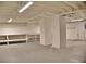 This unfinished basement offers ample storage and utility, with a white painted ceiling and white columns at 1510 Live Oak St, New Smyrna Beach, FL 32168