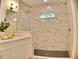 Beautiful bathroom boasts a marble-tiled shower, modern fixtures, and stylish design at 1510 Live Oak St, New Smyrna Beach, FL 32168