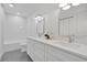 Bathroom featuring dual sinks, white cabinets, and subway tile in a well-lit space at 1510 Live Oak St, New Smyrna Beach, FL 32168