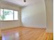 Bright bedroom with a large window and hardwood floors, providing natural light and a warm, inviting feel at 1510 Live Oak St, New Smyrna Beach, FL 32168