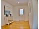 Entryway features hardwood floors, white walls and front door at 1510 Live Oak St, New Smyrna Beach, FL 32168