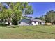Charming exterior view of this lovely house with new landscaping and a metal roof at 1510 Live Oak St, New Smyrna Beach, FL 32168
