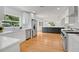 Bright kitchen featuring stainless steel appliances, white cabinets and countertops and a center island at 1510 Live Oak St, New Smyrna Beach, FL 32168