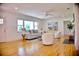 Bright living room boasts hardwood floors, large windows, and modern furnishings at 1510 Live Oak St, New Smyrna Beach, FL 32168