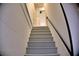 Stairs in this home lead down with a new paint job, as well as an upgraded banister at 1510 Live Oak St, New Smyrna Beach, FL 32168