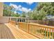 Wooden deck and fenced yard providing a private outdoor space, ideal for entertaining and relaxation at 1510 Live Oak St, New Smyrna Beach, FL 32168