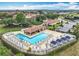 Community pool area featuring lounge chairs, cabanas and a full bar at 16246 Ravenna Ct, Montverde, FL 34756