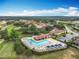 Aerial view of community showcasing the pool with lounge seating at 16246 Ravenna Ct, Montverde, FL 34756