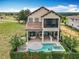 Beautiful backyard featuring a pool, outdoor kitchen and patio area at 16246 Ravenna Ct, Montverde, FL 34756