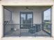 Screened Balcony offers peaceful view, fan, and comfortable seating at 16246 Ravenna Ct, Montverde, FL 34756