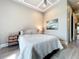 Cozy bedroom with hardwood floors, a side table, and a peaceful vibe at 16246 Ravenna Ct, Montverde, FL 34756