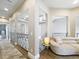 Hallway featuring decorative railing, coffered ceilings, and luxury flooring at 16246 Ravenna Ct, Montverde, FL 34756