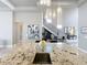 Bright open kitchen featuring granite countertops, stainless steel appliances and island sink at 16246 Ravenna Ct, Montverde, FL 34756