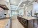 Gourmet kitchen boasts a large island, granite countertops, and sleek appliances at 16246 Ravenna Ct, Montverde, FL 34756