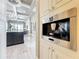 Elegant kitchen featuring a built-in coffee machine with easy access to dining and living spaces at 16246 Ravenna Ct, Montverde, FL 34756