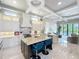 Bright open kitchen with granite countertops, a large center island, and stainless steel appliances at 16246 Ravenna Ct, Montverde, FL 34756