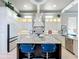 Bright kitchen with granite countertops, white cabinets, stainless steel appliances, and an island at 16246 Ravenna Ct, Montverde, FL 34756