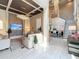 Spacious living room with modern chandeliers, stylish decor, and a staircase leading to an upper level at 16246 Ravenna Ct, Montverde, FL 34756
