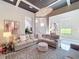 Bright living room featuring a large sectional sofa, contemporary lighting, and an open floor plan at 16246 Ravenna Ct, Montverde, FL 34756