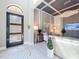 View of a chic living room with a decorative ceiling, a modern front door, and stylish furnishings at 16246 Ravenna Ct, Montverde, FL 34756