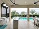 Inviting outdoor kitchen and pool area perfect for entertaining with modern appliances at 16246 Ravenna Ct, Montverde, FL 34756