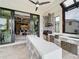 Outdoor kitchen with modern appliances, a grill, and a spacious countertop bar at 16246 Ravenna Ct, Montverde, FL 34756