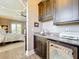 Chic wet bar with granite countertops, sleek cabinetry, and a wine refrigerator at 16246 Ravenna Ct, Montverde, FL 34756
