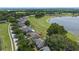 Charming single-Gathering home boasts a lovely lake view and well-manicured lawn at 16729 Tall Grass Ln, Clermont, FL 34711