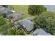 Beautiful home featuring a well-maintained roof, lovely landscaping, and mature trees at 16729 Tall Grass Ln, Clermont, FL 34711