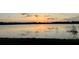 Sunset over the lake is a beautiful sight to see at 16729 Tall Grass Ln, Clermont, FL 34711