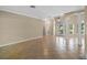 Open concept living area with tile floors, neutral paint, and access to other rooms at 16729 Tall Grass Ln, Clermont, FL 34711