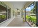 The covered patio offers a peaceful outdoor space with screens and a ceiling fan at 16729 Tall Grass Ln, Clermont, FL 34711
