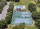 Overhead shot showcasing tennis and basketball courts alongside a community pool for residents to enjoy at 16729 Tall Grass Ln, Clermont, FL 34711