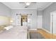 Bright bedroom shows a bed and organized closet with frosted sliding doors, exuding comfort and style at 17404 Chateau Pine Way, Clermont, FL 34711