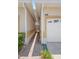 Home exterior featuring a garage and side walkway at 17404 Chateau Pine Way, Clermont, FL 34711