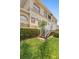 Charming multi-story home featuring a staircase leading up to a private balcony with well-maintained landscaping at 17404 Chateau Pine Way, Clermont, FL 34711
