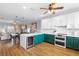 Open-concept kitchen with stainless steel appliances, island and eat in dining at 17404 Chateau Pine Way, Clermont, FL 34711
