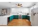 Modern kitchen with stainless steel appliances and quartz countertops at 17404 Chateau Pine Way, Clermont, FL 34711