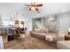 Inviting living area boasts hardwood floors, modern lighting and an open layout at 17404 Chateau Pine Way, Clermont, FL 34711
