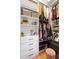 Custom walk-in closet with shelving, drawers, and hanging rods provides organized storage space at 17404 Chateau Pine Way, Clermont, FL 34711