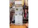 Well-organized walk-in closet with custom shelving, hanging rods, and drawers for ample storage at 17404 Chateau Pine Way, Clermont, FL 34711