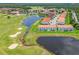 Aerial view of a residential complex with a community pool and golf course at 2041 Greenbriar Ter, Davenport, FL 33837