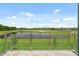 Balcony with view of golf course and pond at 2041 Greenbriar Ter, Davenport, FL 33837