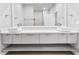 Contemporary bathroom featuring double sinks, spacious vanity, and a large mirror at 2041 Greenbriar Ter, Davenport, FL 33837