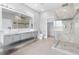 Bright bathroom with walk-in shower, dual sink vanity, and neutral tile floor at 2041 Greenbriar Ter, Davenport, FL 33837