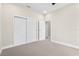 Cozy bedroom featuring a modern closet, and plush neutral carpeting at 2041 Greenbriar Ter, Davenport, FL 33837