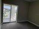 Bedroom featuring a sliding glass door leading to a private balcony at 2041 Greenbriar Ter, Davenport, FL 33837