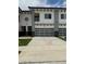 Modern townhome with a two-car garage and well-maintained landscaping at 2041 Greenbriar Ter, Davenport, FL 33837