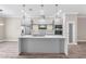 Sleek modern kitchen featuring a large center island, and stainless steel appliances at 2041 Greenbriar Ter, Davenport, FL 33837